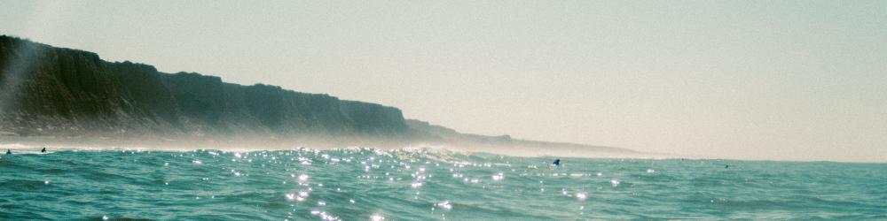 A view from the ocean in southern California looking at the cliffs.